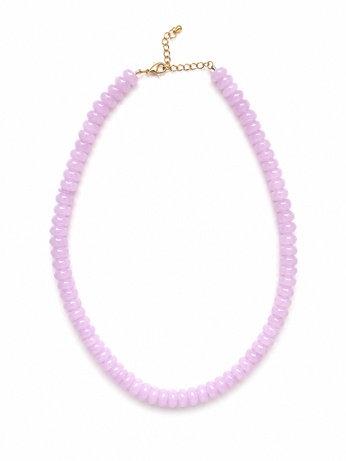 A light pink beaded necklace with a gold-tone chain extender clasp, displayed on a clean white background.