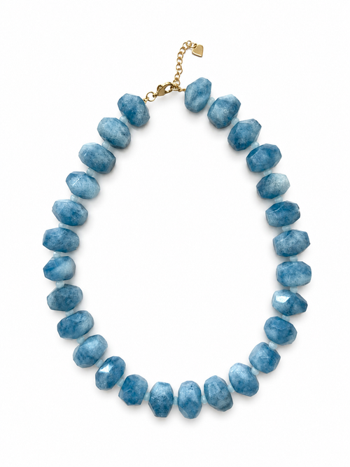 Blue beaded necklace on a white background