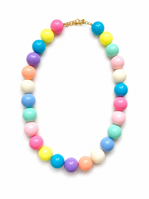 A pastel multicolor beaded necklace with glossy round beads in pink, yellow, blue, purple, peach, mint, and white, arranged in an oval shape on a white background.