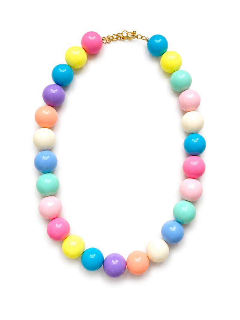 A pastel multicolor beaded necklace with glossy round beads in pink, yellow, blue, purple, peach, mint, and white, arranged in an oval shape on a white background. – handmade beaded jewelry by EmJ Jewels
