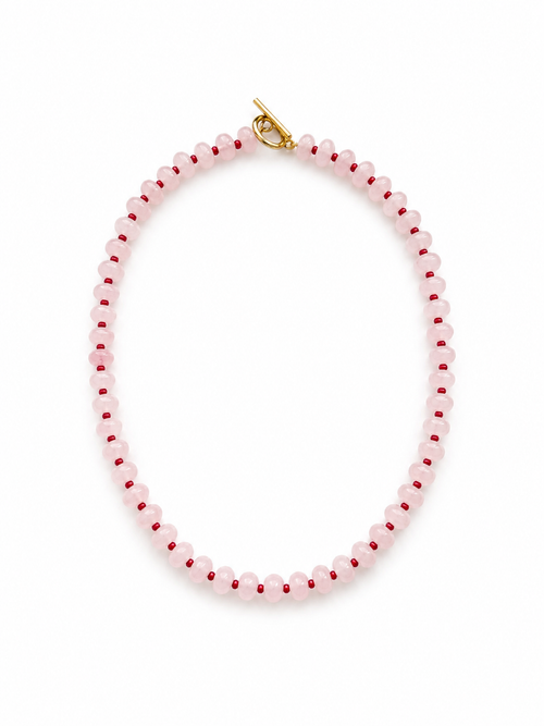 Necklace with pink beads on a white background